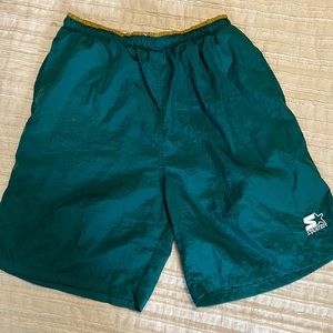 Vintage “Olympic Games Collection” shorts by Starter.